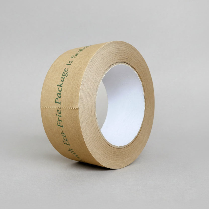 Roll of printed kikusui eco-friendly brown paper tape on a gray background Roll of printed kikusui eco-friendly brown paper tape on a gray background