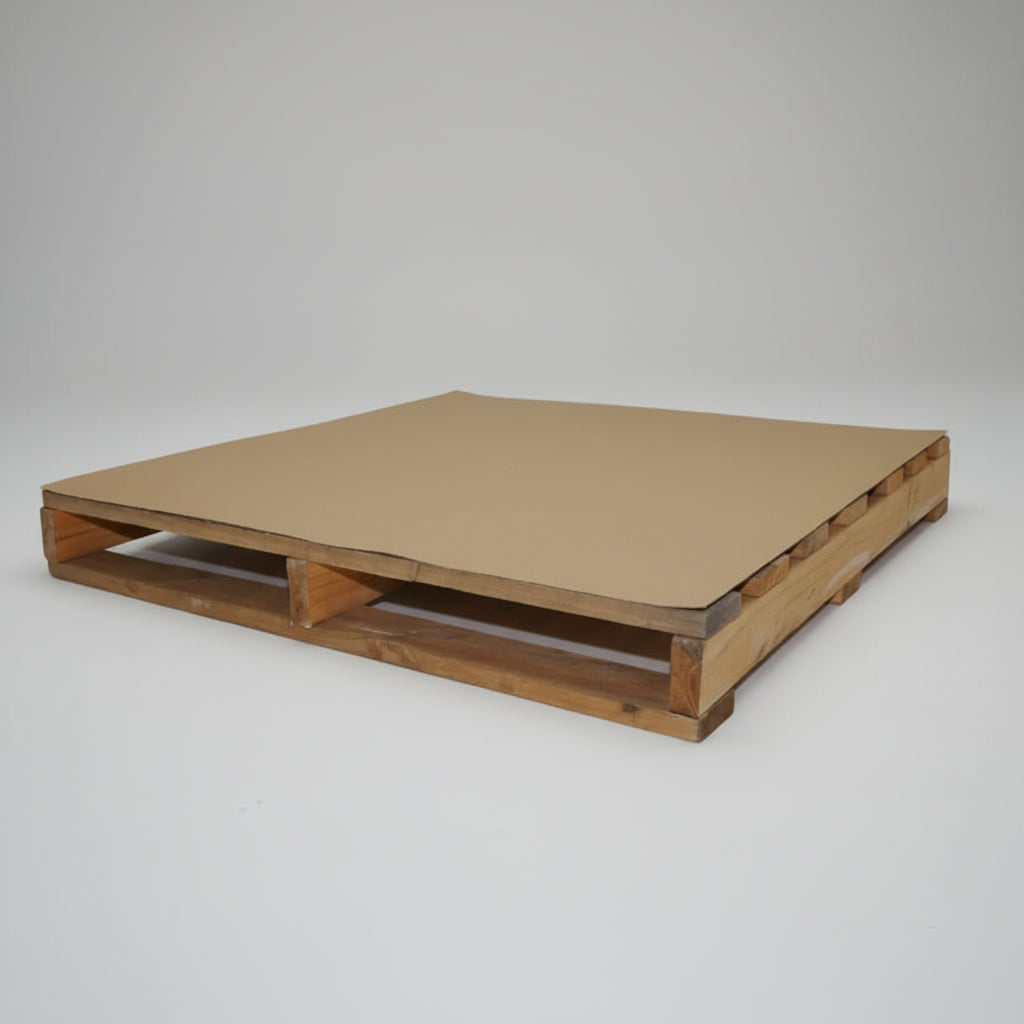 Wooden pallet with a cardboard cover on a white background Wooden pallet with a cardboard cover on a white background