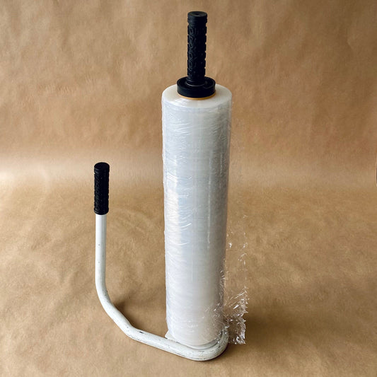 Hand stretch-wrap roll on a metal dispenser