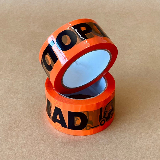 Two rolls of orange printed handling tape