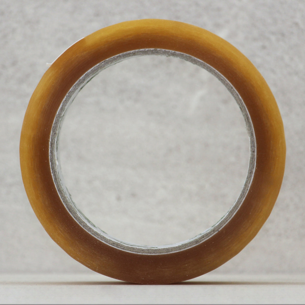 Clear natural rubber packaging tape roll