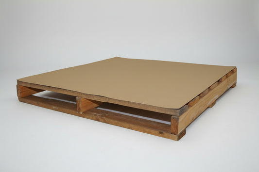 Wooden pallet with a cardboard cover on a white background